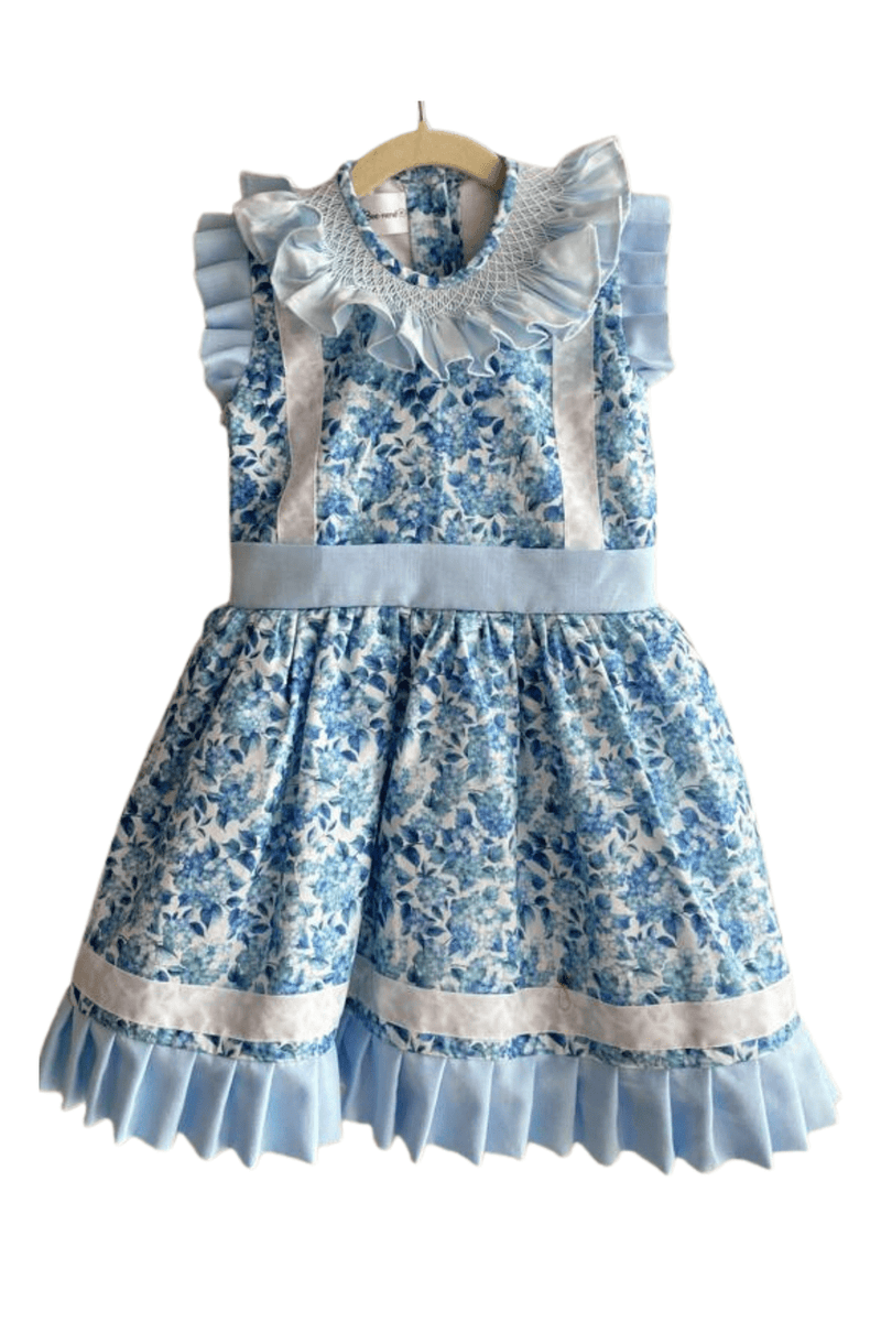 Le Jardin Dress - Blue girl dress in floral pattern with smocking and ribbon detail | Bee•nené